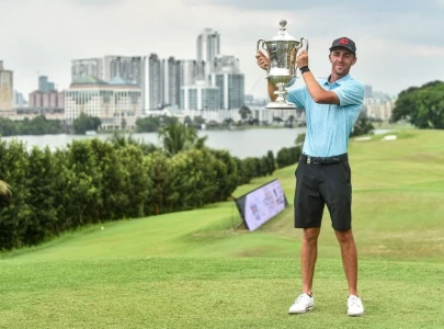 puig clinches malaysian open golf title