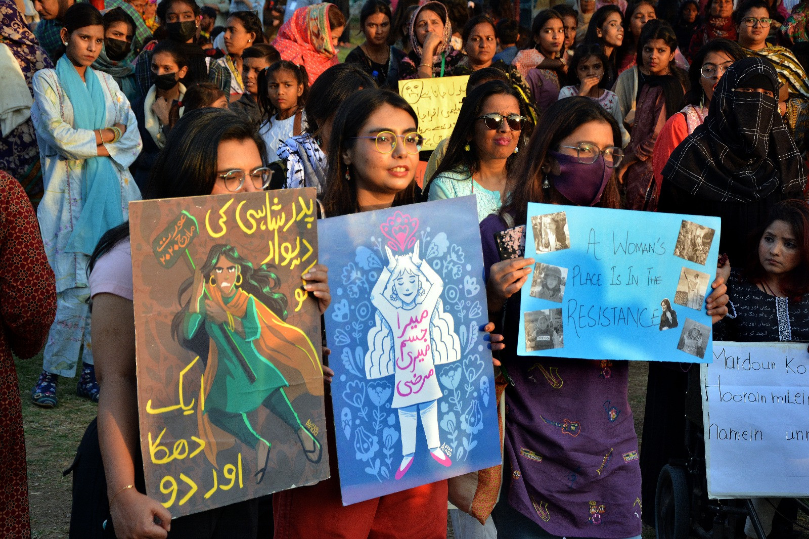 on international women s day the participants of the aurat march held at karachi s frere hall hold various placards photo express