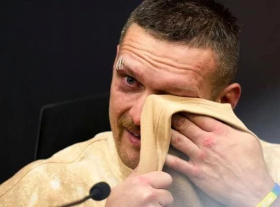 usyk in tears for late father after historic heavyweight win