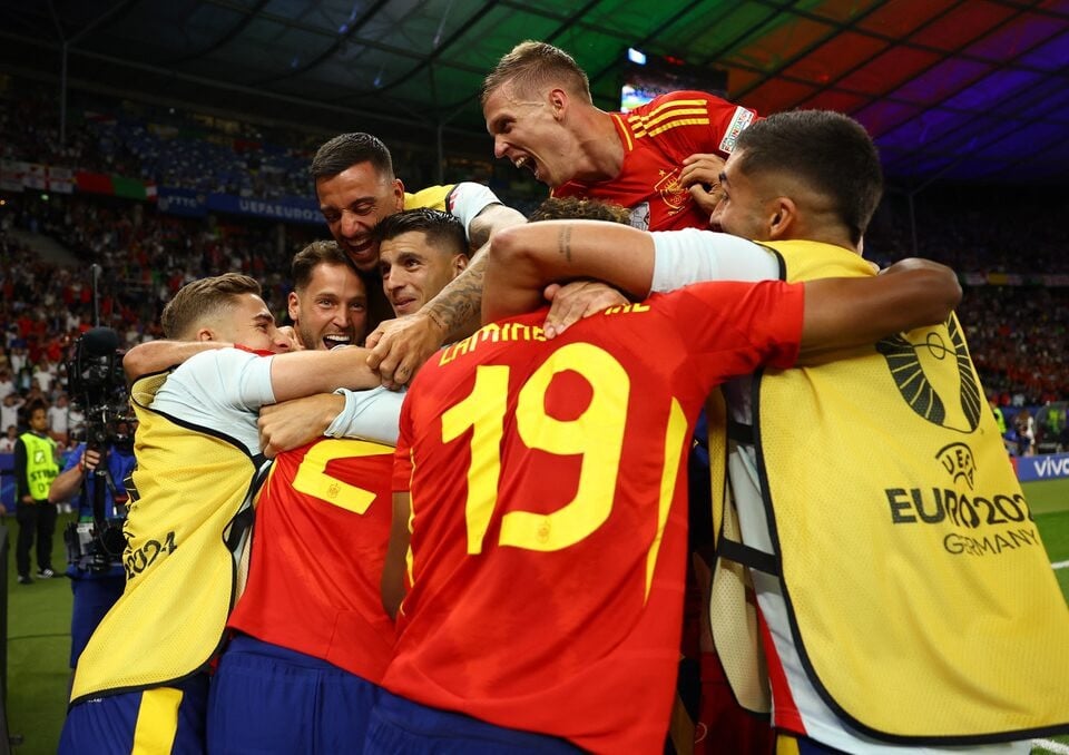 spain s mikel oyarzabal celebrates scoring their second goal with teammates at the euro cup 2024 final in berlin germany on july 14 2024 photo reuters