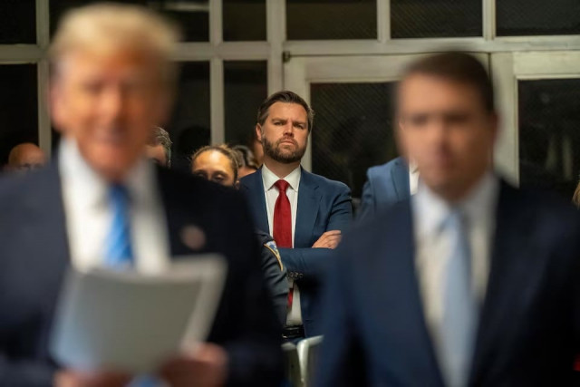 us senator jd vance listens to former president donald trump address the pool press outside the manhattan criminal court room during trial in nyc may 13 2024 photo reuters us senator jd vance listens to former president donald trump address the pool press outside the manhattan criminal court room during trial in nyc may 13 2024 photo reuters