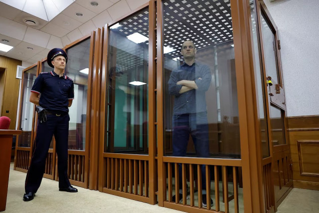 wall street journal reporter evan gershkovich who stands trial on spying charges is seen inside an enclosure for defendants before a court hearing in yekaterinburg russia june 26 2024 photo reuters wall street journal reporter evan gershkovich who stands trial on spying charges is seen inside an enclosure for defendants before a court hearing in yekaterinburg russia june 26 2024 photo reuters