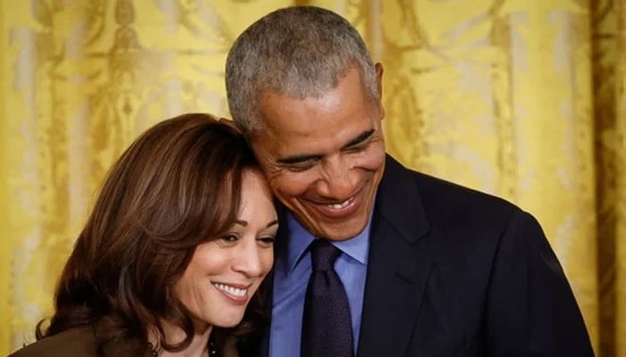 former president barack obama hugs vice president kamala harris during an event to mark the 2010 passage of the affordable care act in the east room of the white house on april 5 2022 in washington dc photo afp