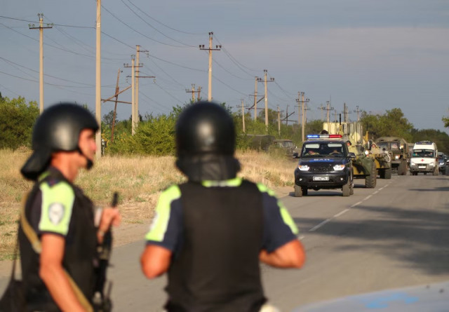russian law enforcement officers drive along a road following the seizure of hostages by a group of inmates in the penal colony ik 19 in the town of surovikino in the volgograd region russia on august 23 2024 photo reuters russian law enforcement officers drive along a road following the seizure of hostages by a group of inmates in the penal colony ik 19 in the town of surovikino in the volgograd region russia on august 23 2024 photo reuters