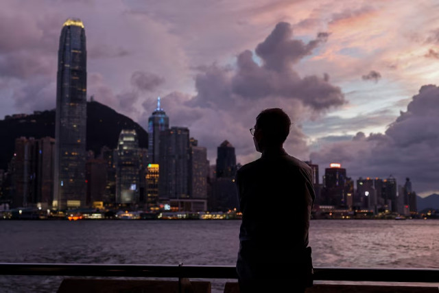 a man stands in front of victoria harbour with the central financial district in the background as typhoon yagi approaches in hong kong china on september 5 2024 photo reuters a man stands in front of victoria harbour with the central financial district in the background as typhoon yagi approaches in hong kong china on september 5 2024 photo reuters