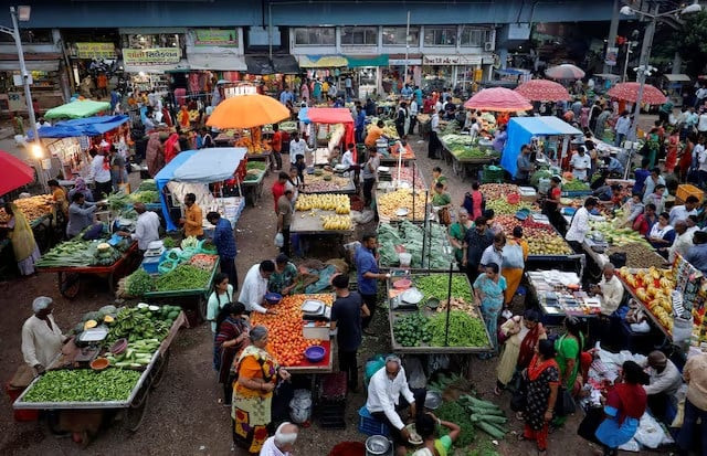 customers buy fruits and vegetables at an open air evening market in ahmedabad india photo reuters customers buy fruits and vegetables at an open air evening market in ahmedabad india photo reuters