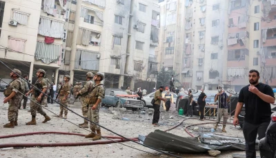 people and members of the military inspect the site of an israeli strike in the southern suburbs of beirut lebanon on september 20 2024 photo reuters