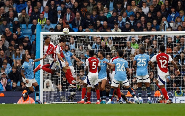 arsenal s gabriel magalhaes scores their second goal during manchester city v arsenal at the etihad stadium in manchester uk on september 22 2024 photo reuters arsenal s gabriel magalhaes scores their second goal during manchester city v arsenal at the etihad stadium in manchester uk on september 22 2024 photo reuters