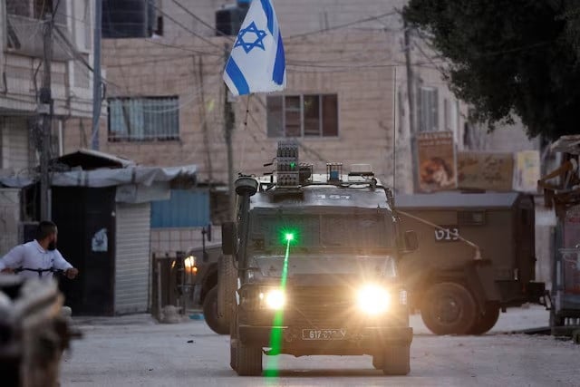 a military vehicle with a laser transits during an israeli raid in jenin in the israeli occupied west bank on september 25 2024 photo reuters