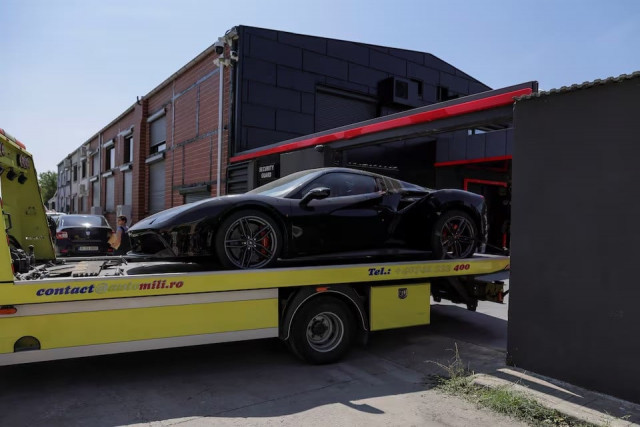 authorities remove vehicles from andrew tate s residence in voluntari near bucharest romania august 24 2024 photo reuters authorities remove vehicles from andrew tate s residence in voluntari near bucharest romania august 24 2024 photo reuters