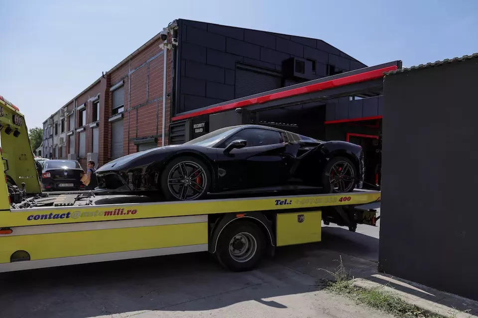 authorities remove vehicles from andrew tate s residence in voluntari near bucharest romania august 24 2024 photo reuters authorities remove vehicles from andrew tate s residence in voluntari near bucharest romania august 24 2024 photo reuters