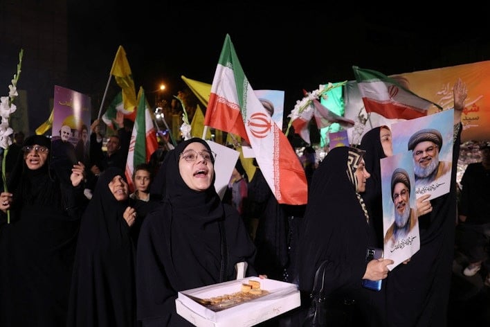 iranians celebrate on a street in tehran iran after iran launched ballistic missiles at israel on october 1 2024 photo west asia news agency