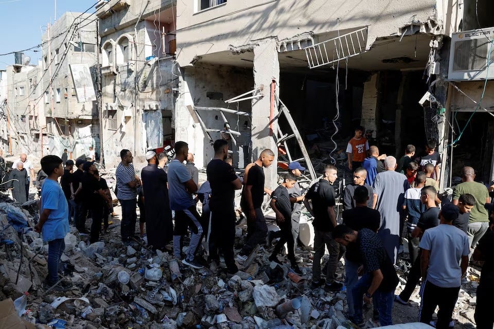 palestinians inspect the damage at the site of an israeli air strike in tulkarm camp in tulkarm in the israeli occupied west bank on october 4 2024 photo reuters