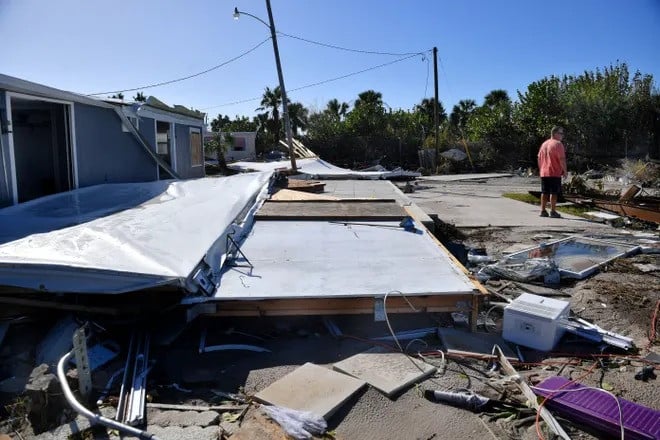 ed eckert surveys his neighborhood saturday at shady haven mobile home park in englewood florida following hurricane milton eckert said he spent last winter remodeling his trailer and was looking forward to enjoying it this winter he had just finished cleaning up from hurricane helene when hurricane milton came along two weeks later and moved his entire trailer at left twelve feet inland his neighbor s trailer was completely destroyed photo mike lang sarasota herald tribune