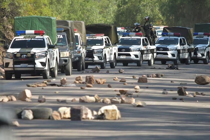 police vehicles line up while attempting to dismantle a blockade set by supporters of bolivia s former president evo morales in protest of the government of president luis arce in parotani bolivia on october 25 2024 photo reuters