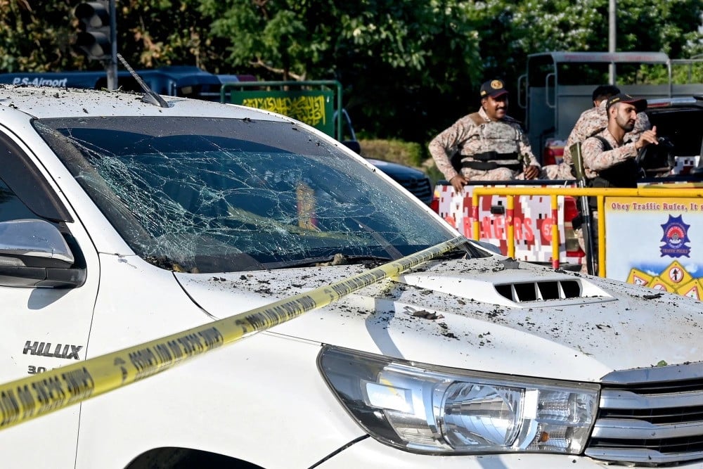 military personnel guard the site of an explosion near the international airport in karachi photo afp