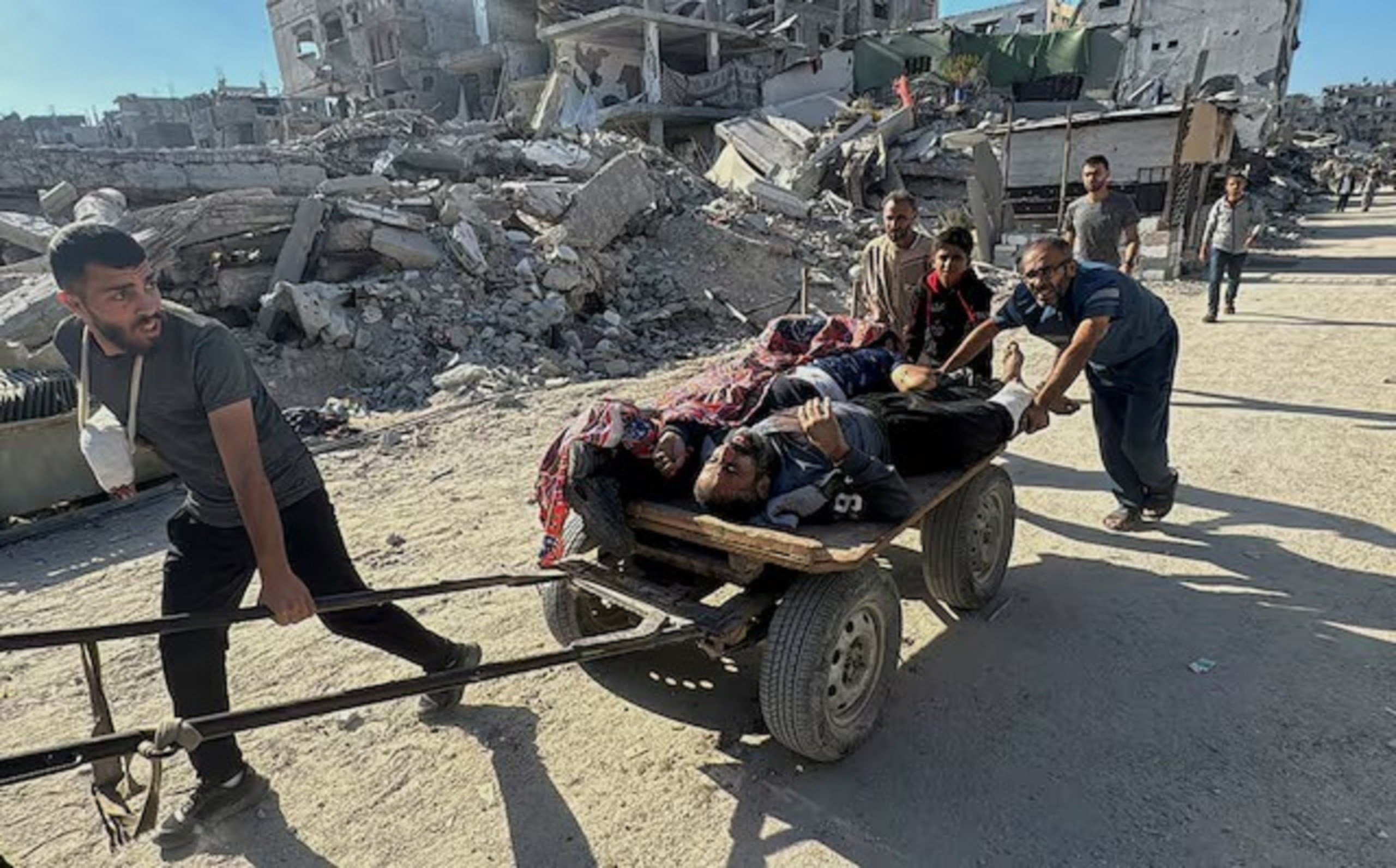 palestinians assist casualties following an israeli strike amid the israel hamas conflict in beit lahiya in northern gaza on october 30 2024 photo reuters