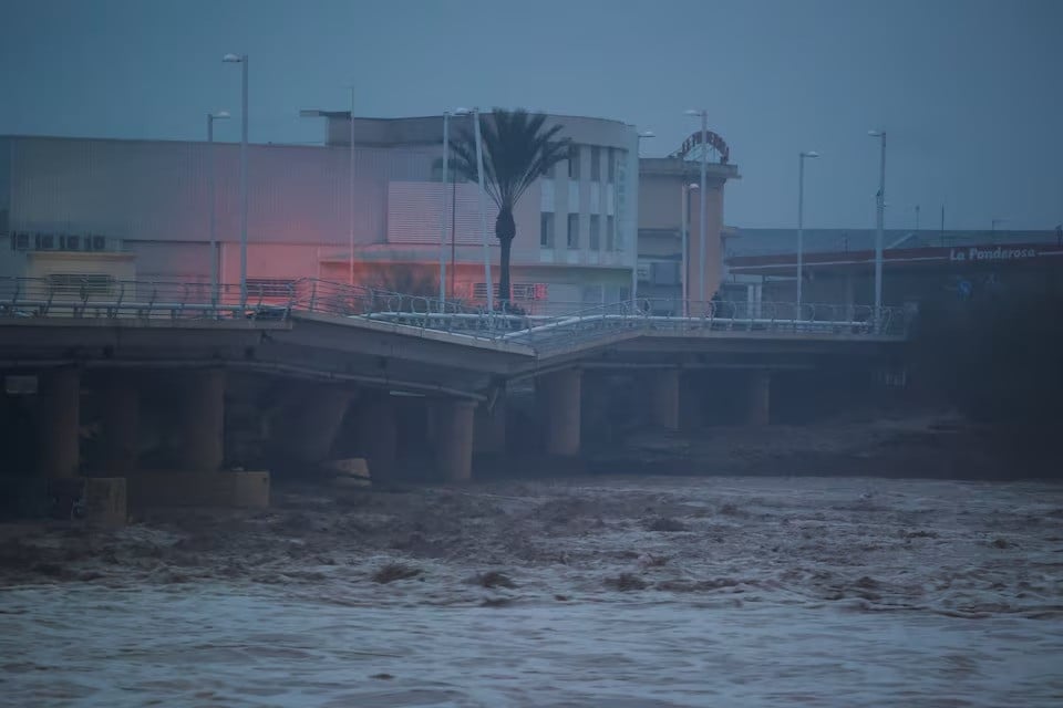 a river flows under a partially collapsed bridge affected by torrential rains that caused flooding in the town of carlet valencia region spain on october 30 2024 photo reuters