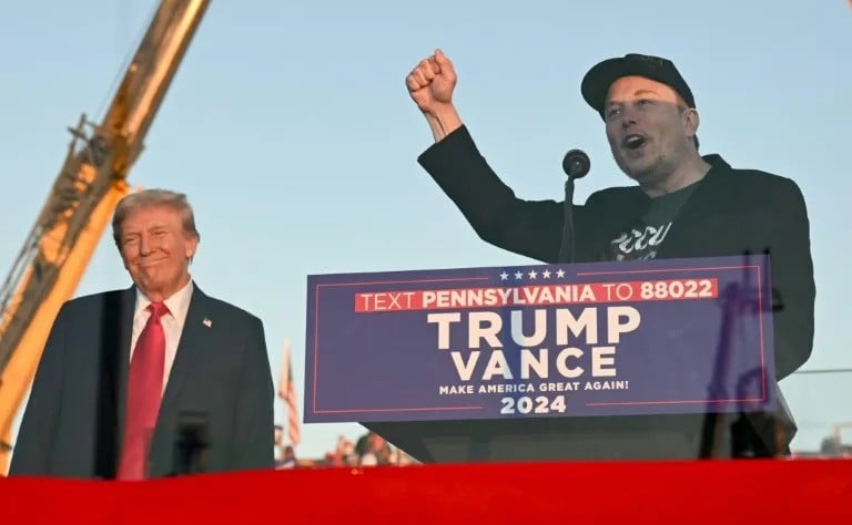 tesla ceo elon musk r speaks on stage as he joins former us president and republican presidential candidate donald trump during a campaign rally photo afp