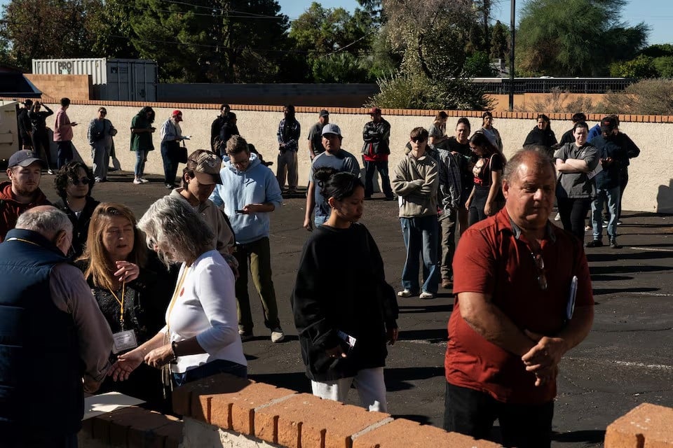 people line up to cast their votes in the 2024 us presidential election on election day outside of a polling station in phoenix arizona us on november 5 2024 photo reuters