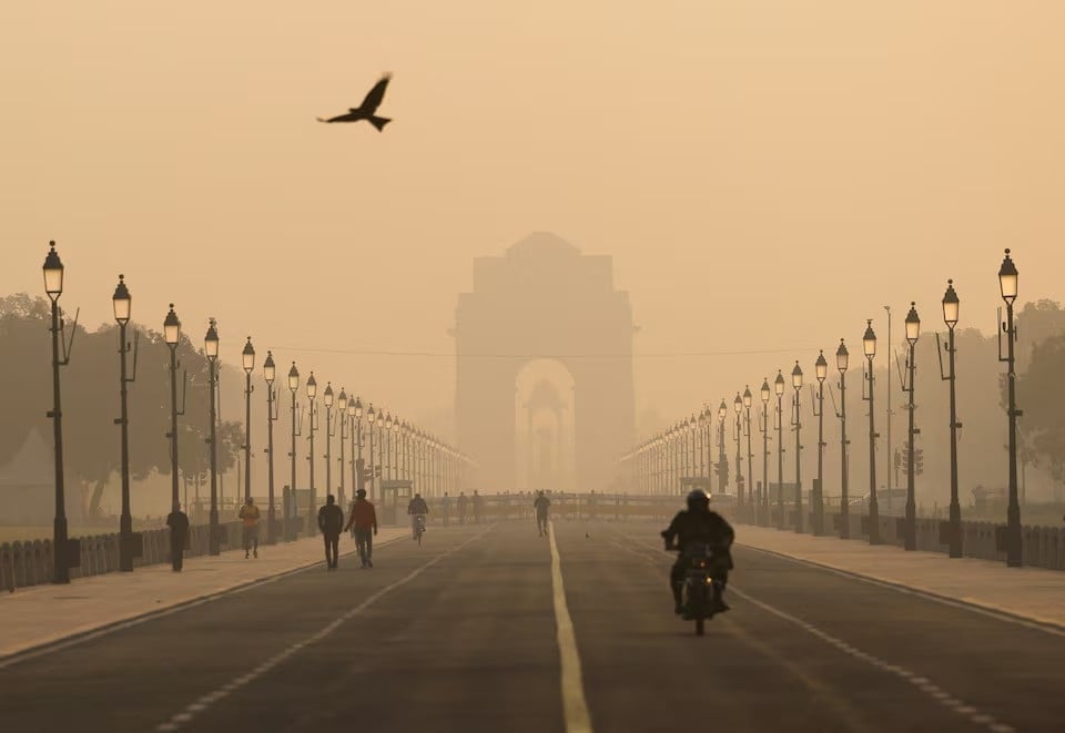 people walk on kartavyapath near india gate on a hazy morning in new delhi india on november 1 2024 photo reuters