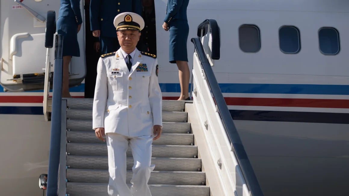 miao hua director of the political work department of china s central military commission disembarks his aircraft after arriving at pyongyang international airport on october 14 2019 photo afp