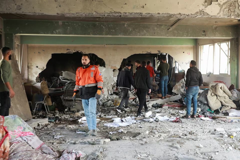 palestinians inspect the site of an israeli strike on a school sheltering displaced people amid the israel hamas conflict in gaza city december 3 2024 photo reuters