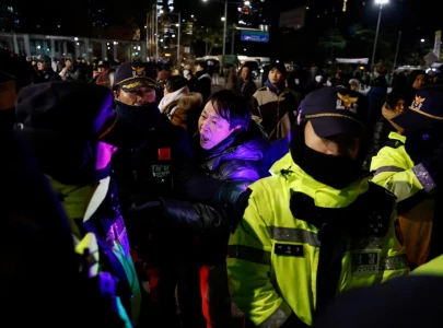 south korea s yoon moves to lift martial law after standoff with parliament