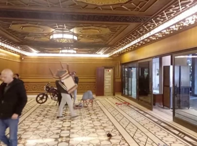 syrians roam assad s palaces snapping photos and taking mementos