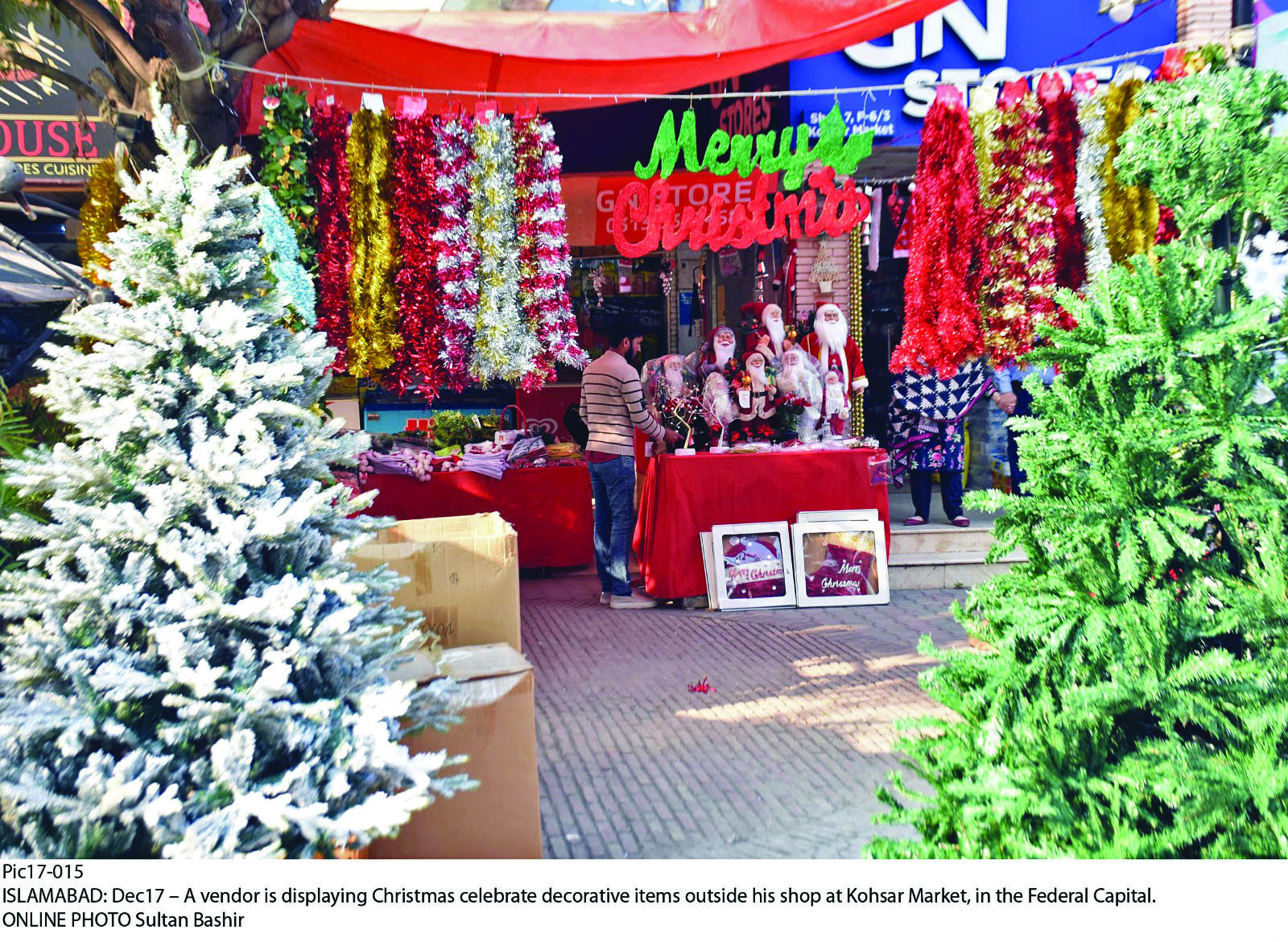 a vendor displays vibrant christmas related accessories outside a shop at kohsar market in the federal capital presenting a treat for the eyes photo online