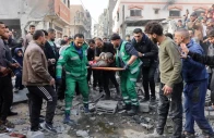 rescuers evacuate a wounded child at the site of an israeli attack in a residential area in the tuffah neighbourhood east of gaza city on december 25 2024 photo afp