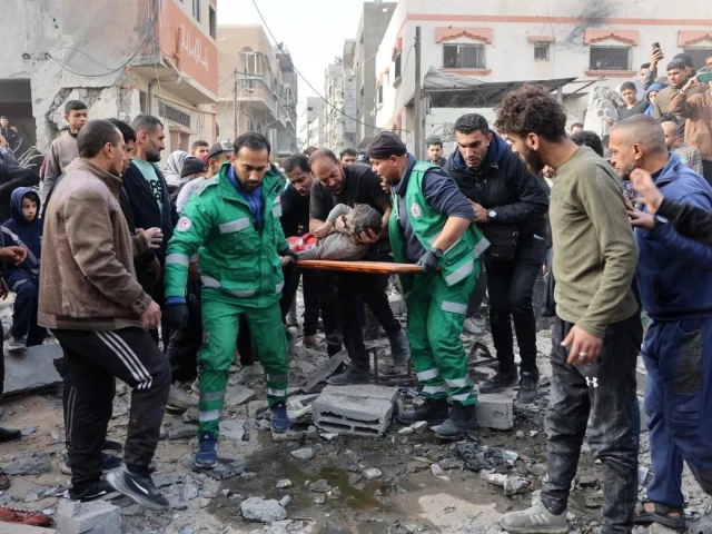 rescuers evacuate a wounded child at the site of an israeli attack in a residential area in the tuffah neighbourhood east of gaza city on december 25 2024 photo afp rescuers evacuate a wounded child at the site of an israeli attack in a residential area in the tuffah neighbourhood east of gaza city on december 25 2024 photo afp