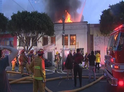 los angeles fire about 100 firefighters battle blaze in commercial building