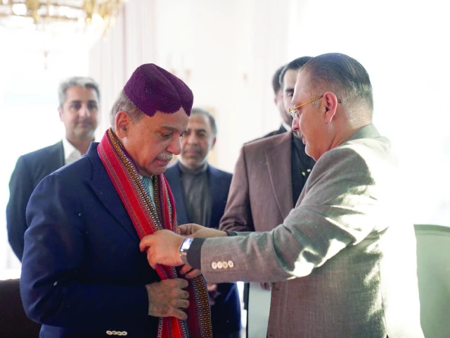 sindh s senior minister presents an ajrak to pm shehbaz sharif at his residence photo express sindh s senior minister presents an ajrak to pm shehbaz sharif at his residence photo express