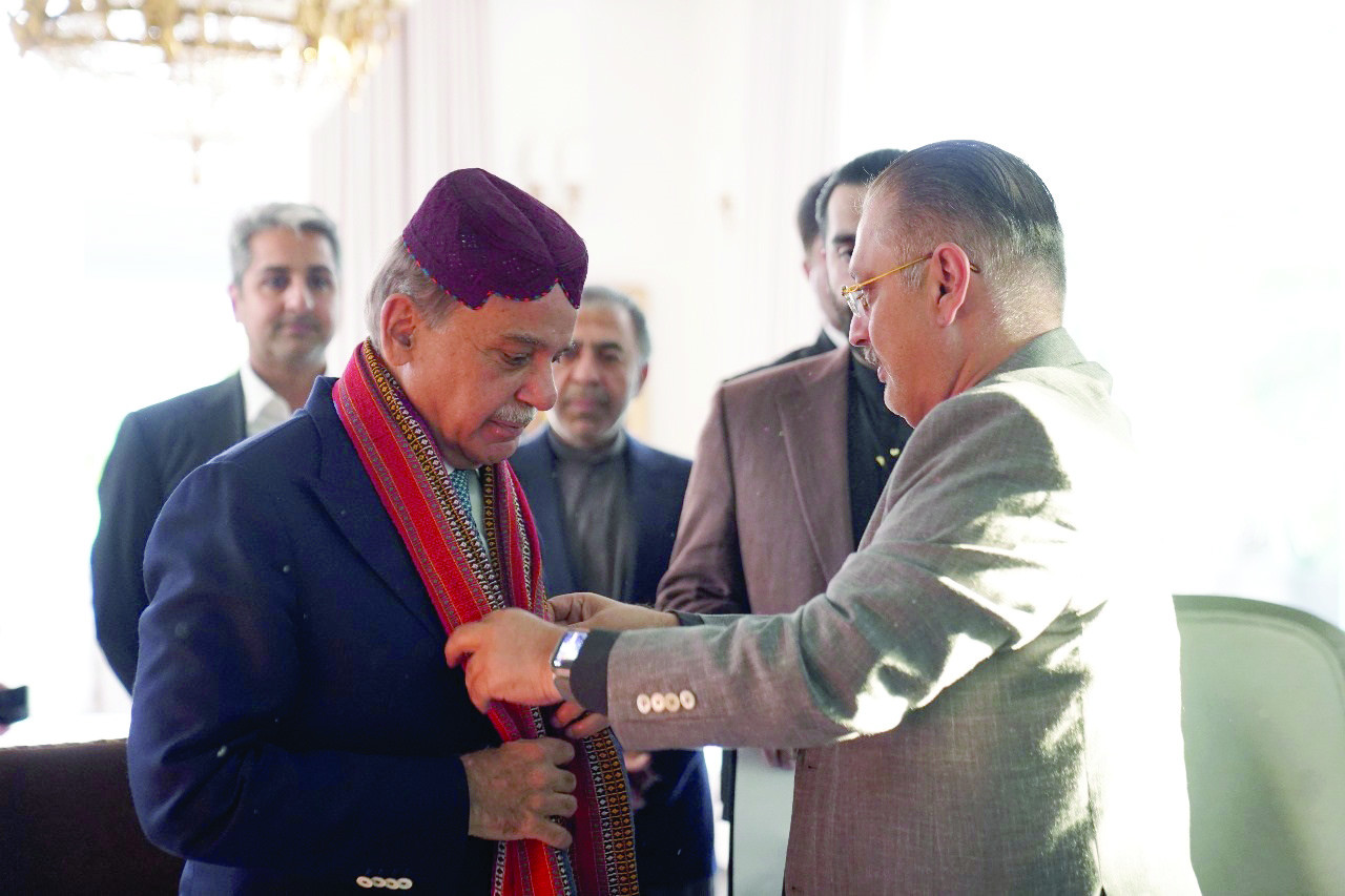 sindh s senior minister presents an ajrak to pm shehbaz sharif at his residence photo express