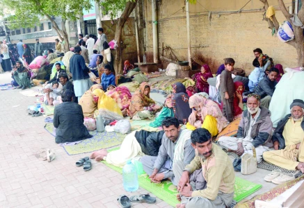 attendants of patients from outside the city camp in an open space at the civil hospital due to lack of free shelters photo jalal qureshi express