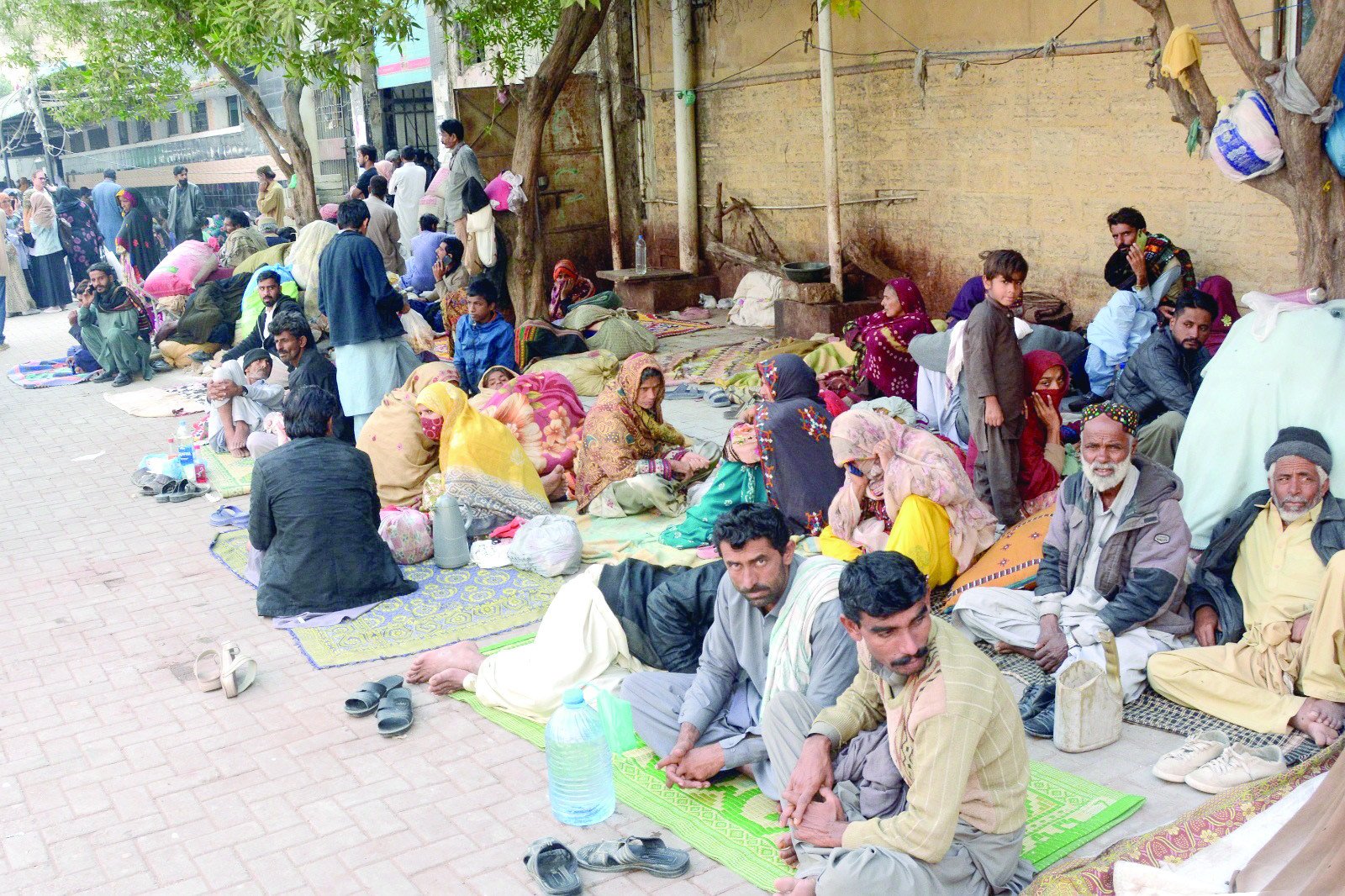 attendants of patients from outside the city camp in an open space at the civil hospital due to lack of free shelters photo jalal qureshi express