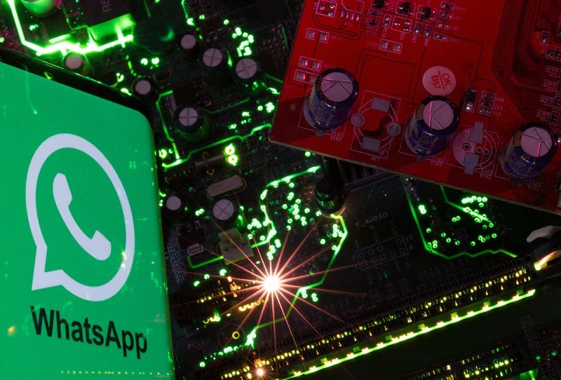 a smartphone with a displayed whatsapp logo is placed on a computer motherboard in this illustration taken february 23 2023 photo reuters