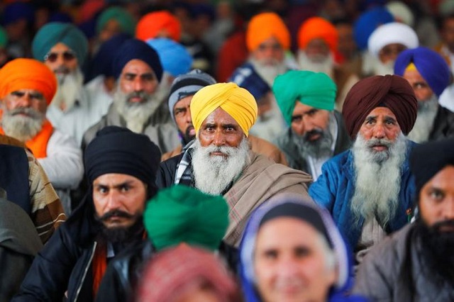 farmers listen to a speaker during a protest against the farm laws at singhu border near new delhi india january 30 2021 photo reuters
