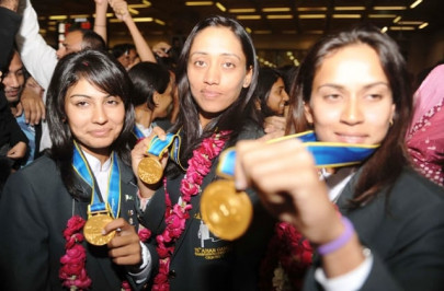 pakistan women s team returns after striking gold