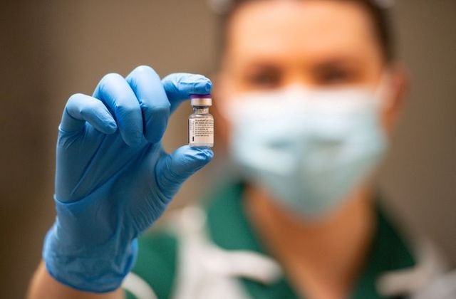 a nurse holds a vial of the pfizer biontech covid 19 vaccine at university hospital on the first day of the largest immunisation program in the british history in coventry britain december 8 2020 photo reuters