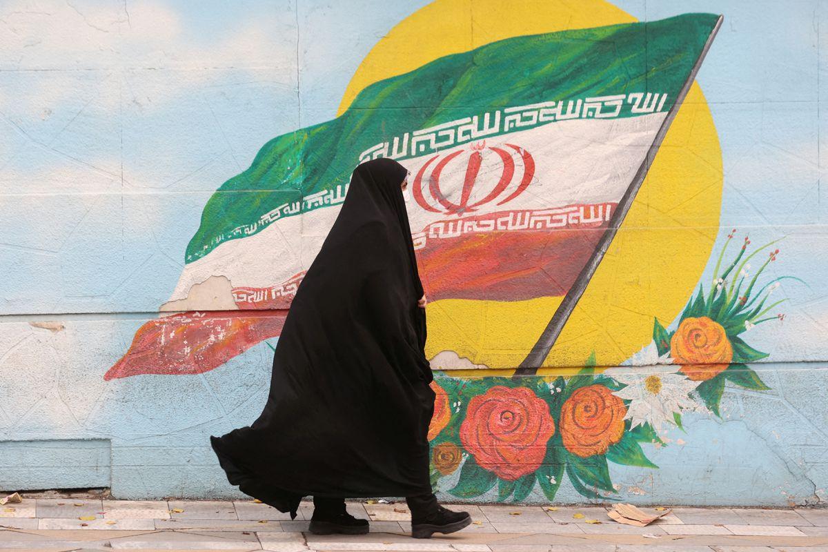 a woman walks after the morality police shut down in a street in tehran iran december 6 2022 photo reuters