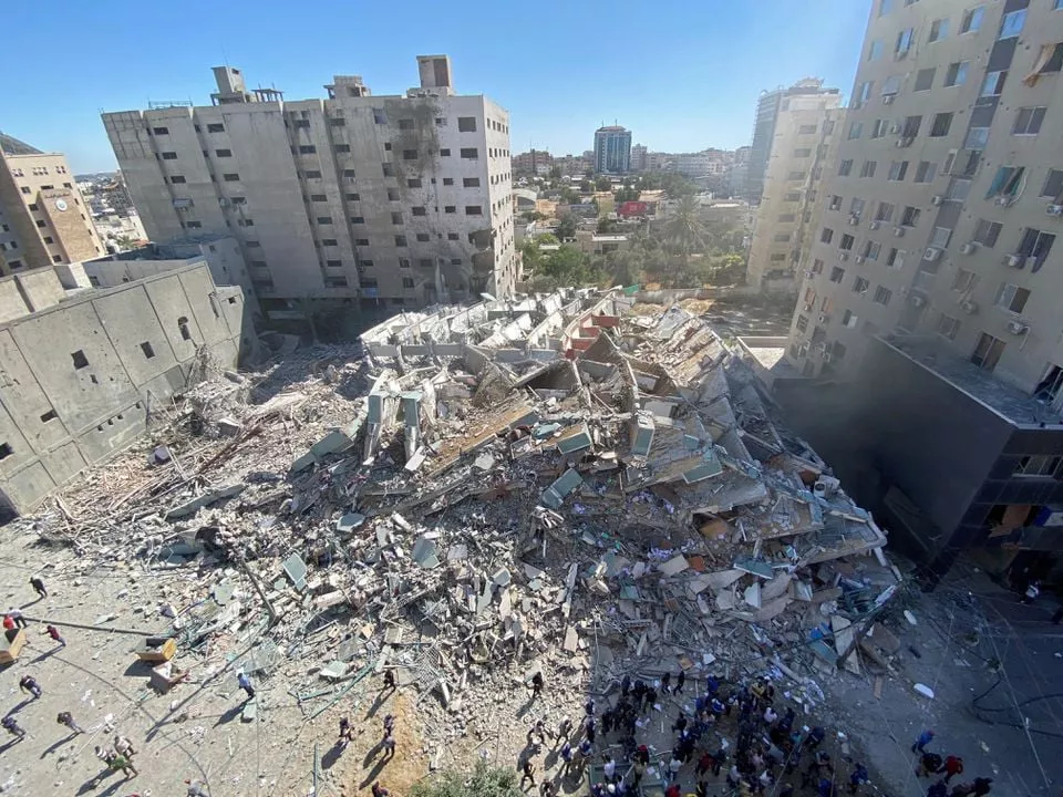 a tower housing ap al jazeera offices collapses after israeli missile strikes in gaza city may 15 2021 photo reuters a tower housing ap al jazeera offices collapses after israeli missile strikes in gaza city may 15 2021 photo reuters