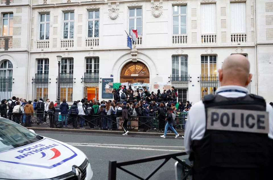 french police stand guard as students block the entrance of the lycee montaigne high school to protest as part of a nationwide day of strike in paris france october 18 2022 reuters french police stand guard as students block the entrance of the lycee montaigne high school to protest as part of a nationwide day of strike in paris france october 18 2022 reuters