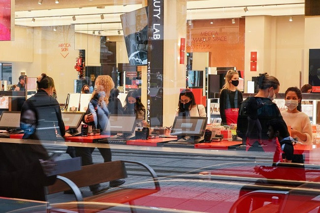 shoppers wear protective face masks inside a store as businesses re open to vaccinated patrons in the wake of coronavirus disease covid 19 regulations easing following months of lockdown orders to curb the rise in the number of cases in sydney australia october 12 2021 photo reuters