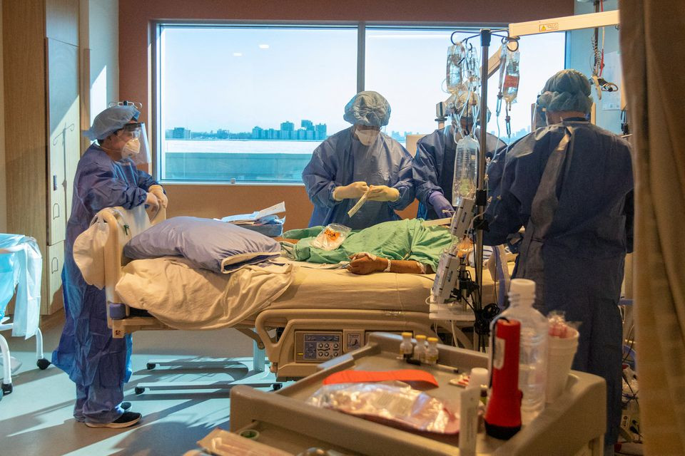 nurses doctors and a respiratory therapist intubate a coronavirus disease covid 19 patient as the omicron coronavirus variant continues to put pressure on humber river hospital in toronto ontario canada january 20 2022 photo reuters