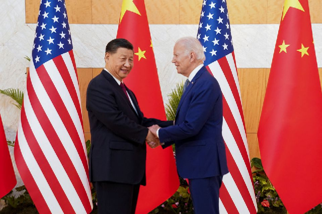 US President Joe Biden shakes hands with Chinese President Xi Jinping on a sidelines of a G20 leaders' limit in Bali, Indonesia, Nov 14, 2022. PHOTO: REUTERS