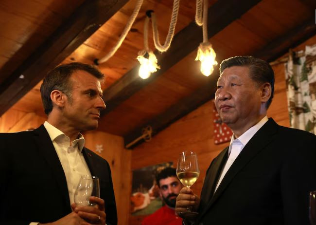 french president emmanuel macron and chinese president xi jinping enjoy a drink in a restaurant on tuesday may 7 2024 at the tourmalet pass in the pyrenees mountains photo reuters
