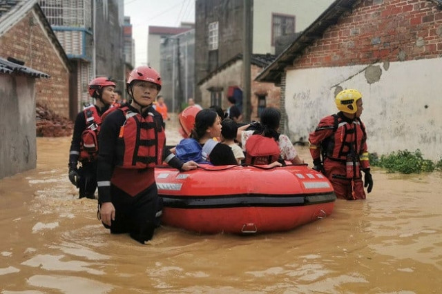 rescue workers evacuate flood affected residents with a dinghy after heavy rainfall brought by typhoon chaba flooded the villages in beihai guangxi zhuang autonomous region china july 4 2022 photo reuters rescue workers evacuate flood affected residents with a dinghy after heavy rainfall brought by typhoon chaba flooded the villages in beihai guangxi zhuang autonomous region china july 4 2022 photo reuters