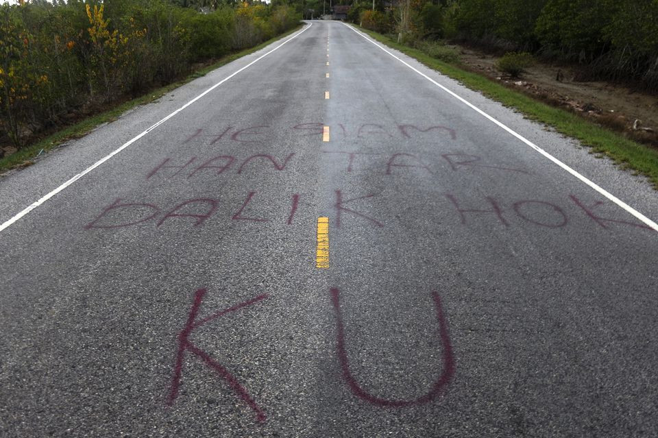 separatist graffiti is seen on a road near pattani june 6 2014 one of three southernmost provinces of thailand where government troops have fought muslim insurgents since 2004 graffiti reads hey siamese   bring back our rights reuters